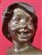 Smiling girl's face Bronze signed