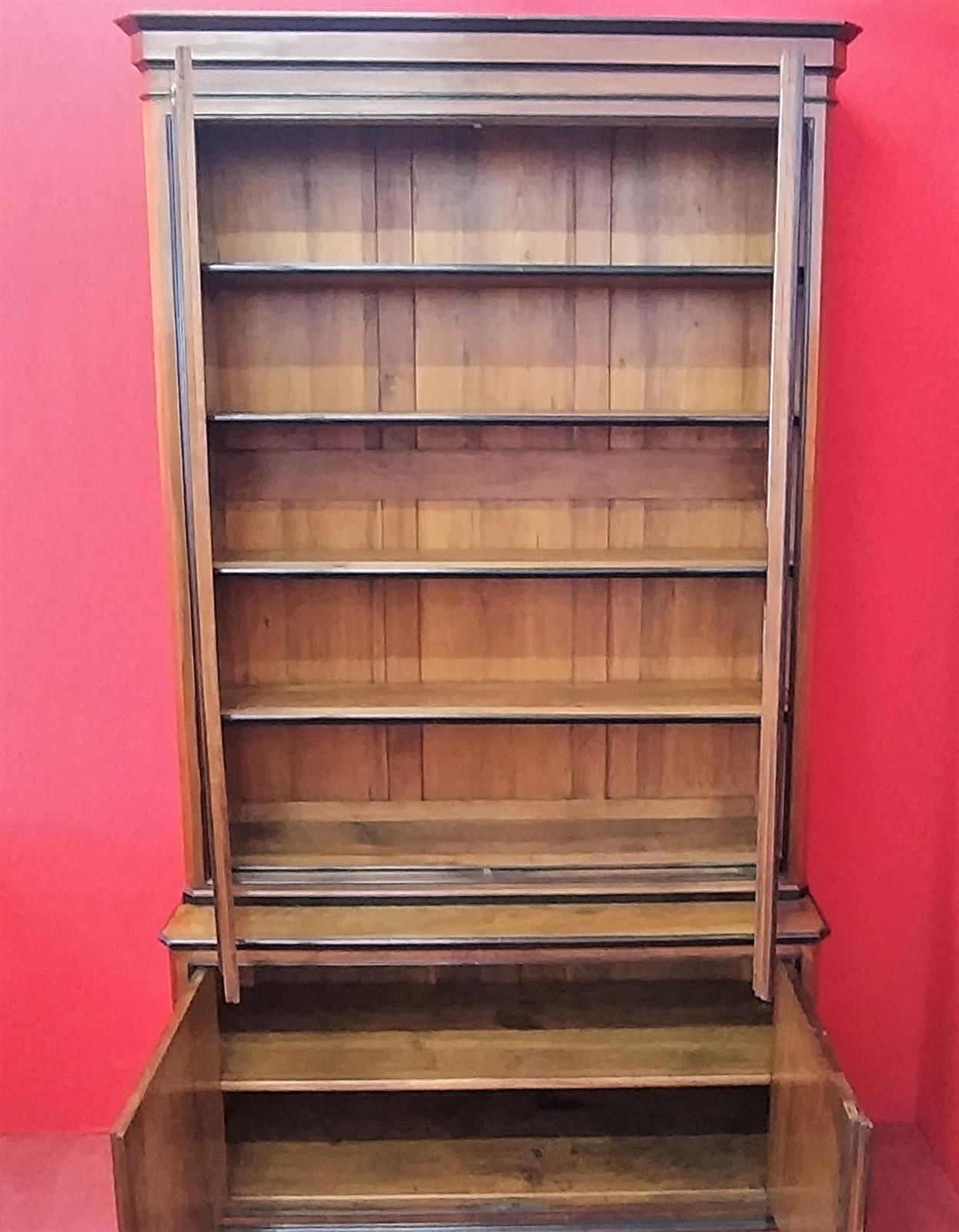 Walnut bookcase with black frames