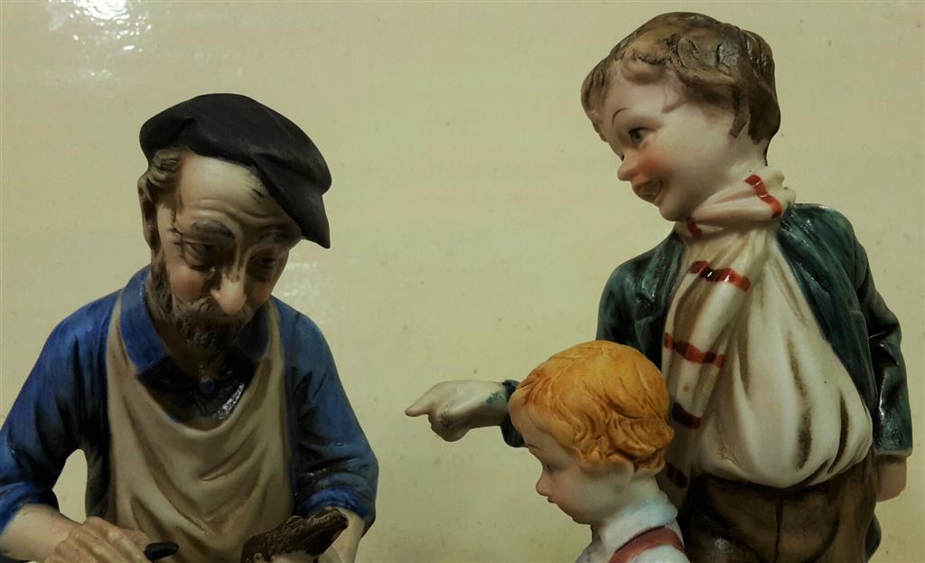 Cobbler with children in hand-painted ceramics