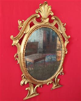 Specchio ovale in legno dorato