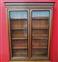 Walnut bookcase with black frames