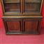 Walnut bookcase with black frames