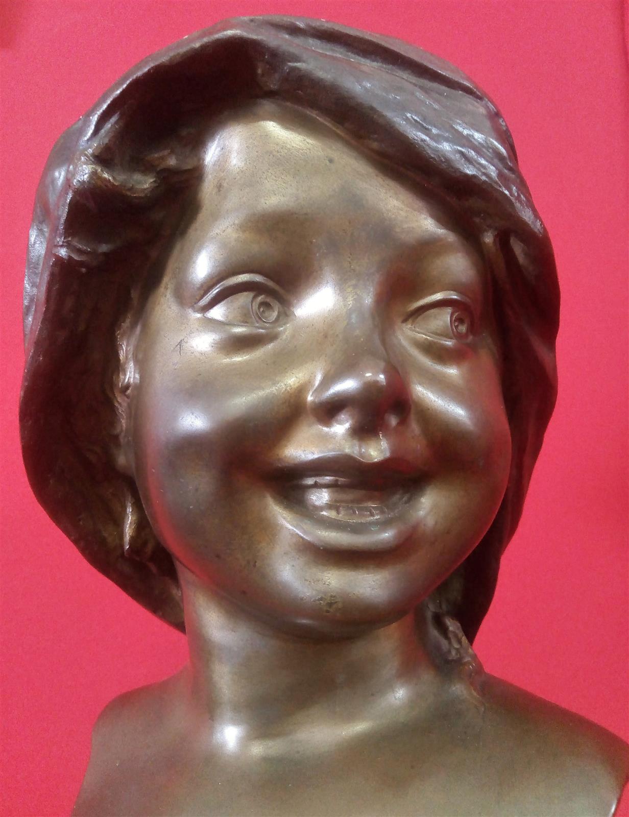 Smiling girl's face Bronze signed