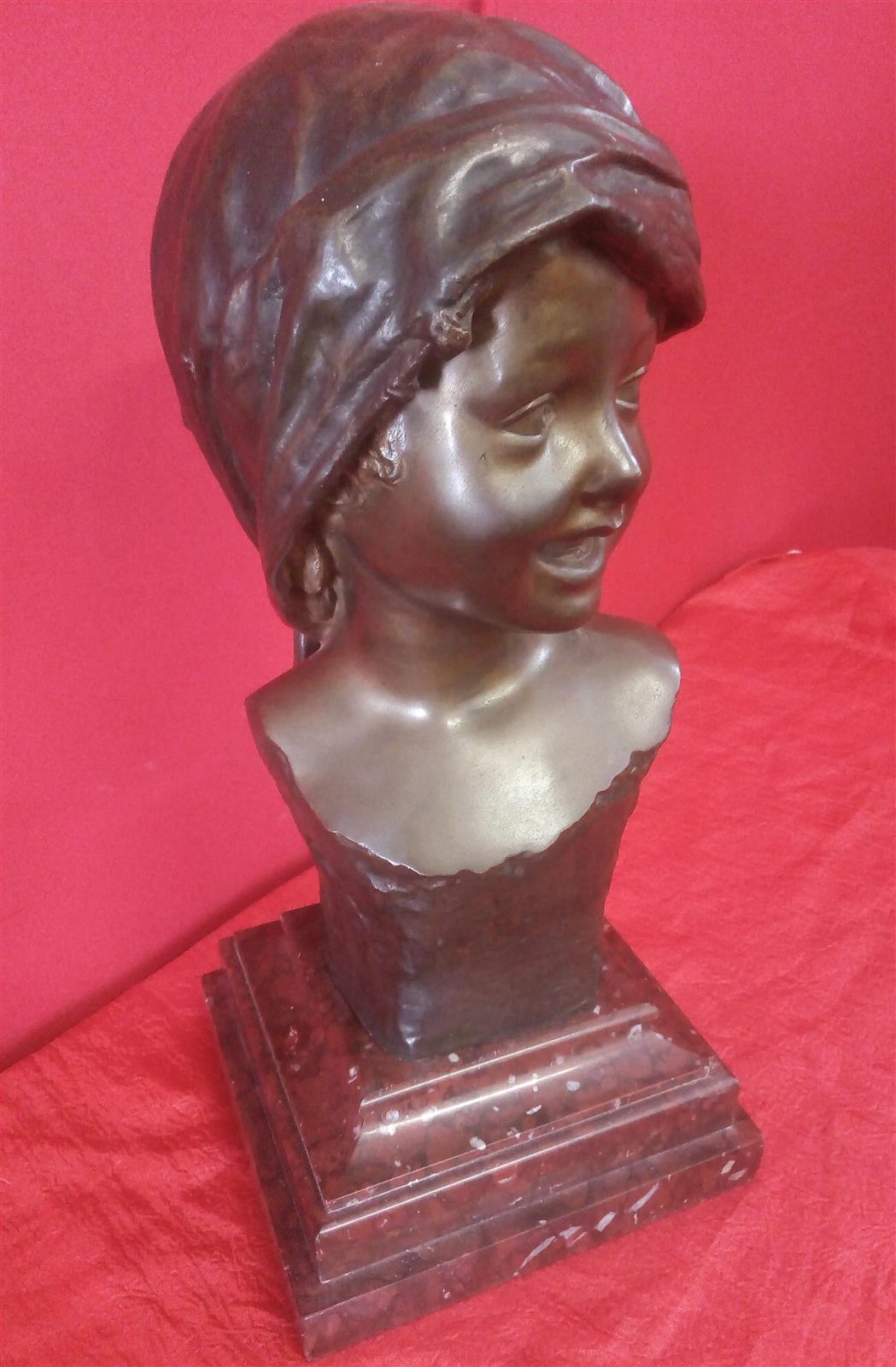 Smiling girl's face Bronze signed