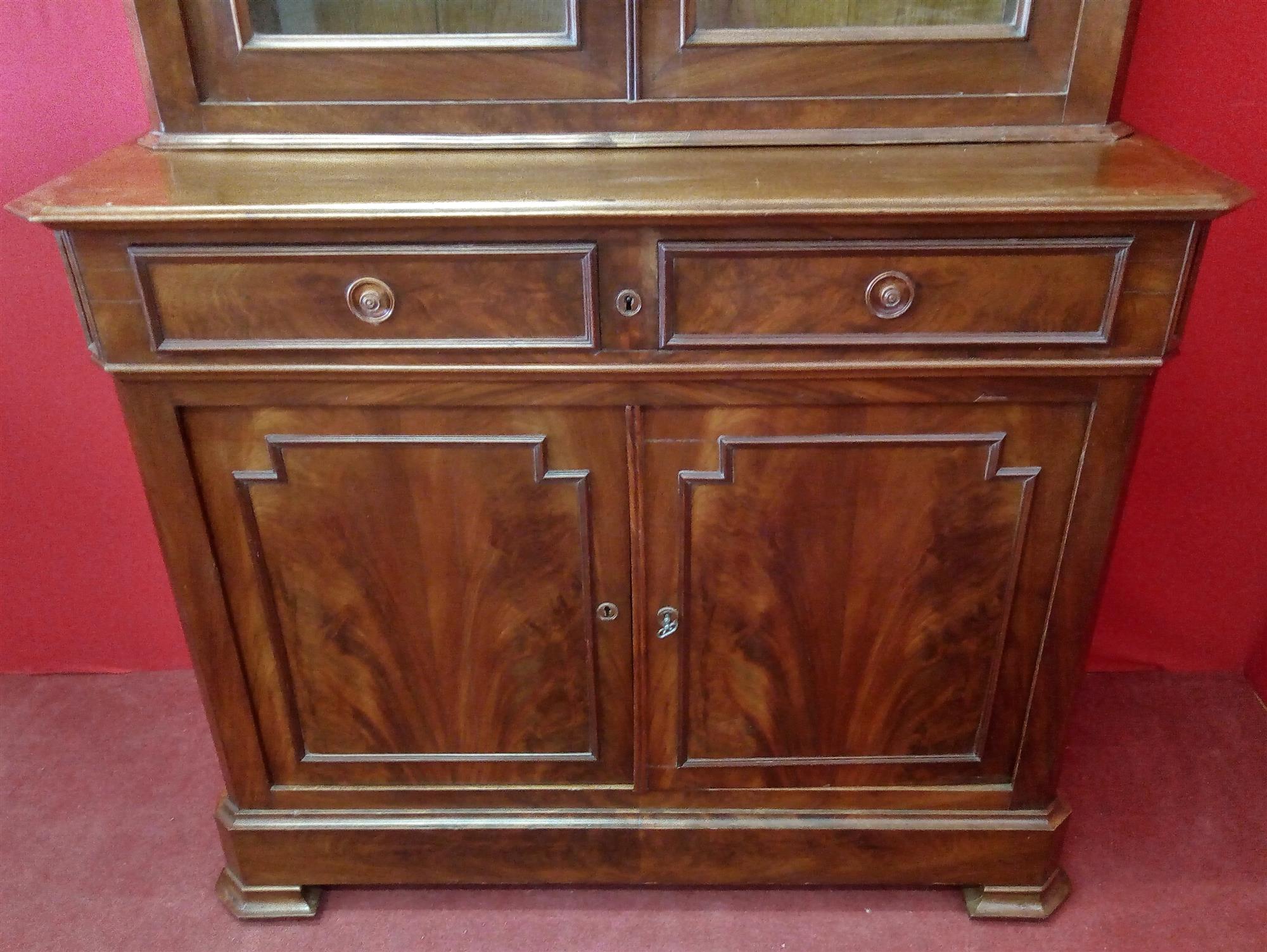 Small mahogany two-door bookcase