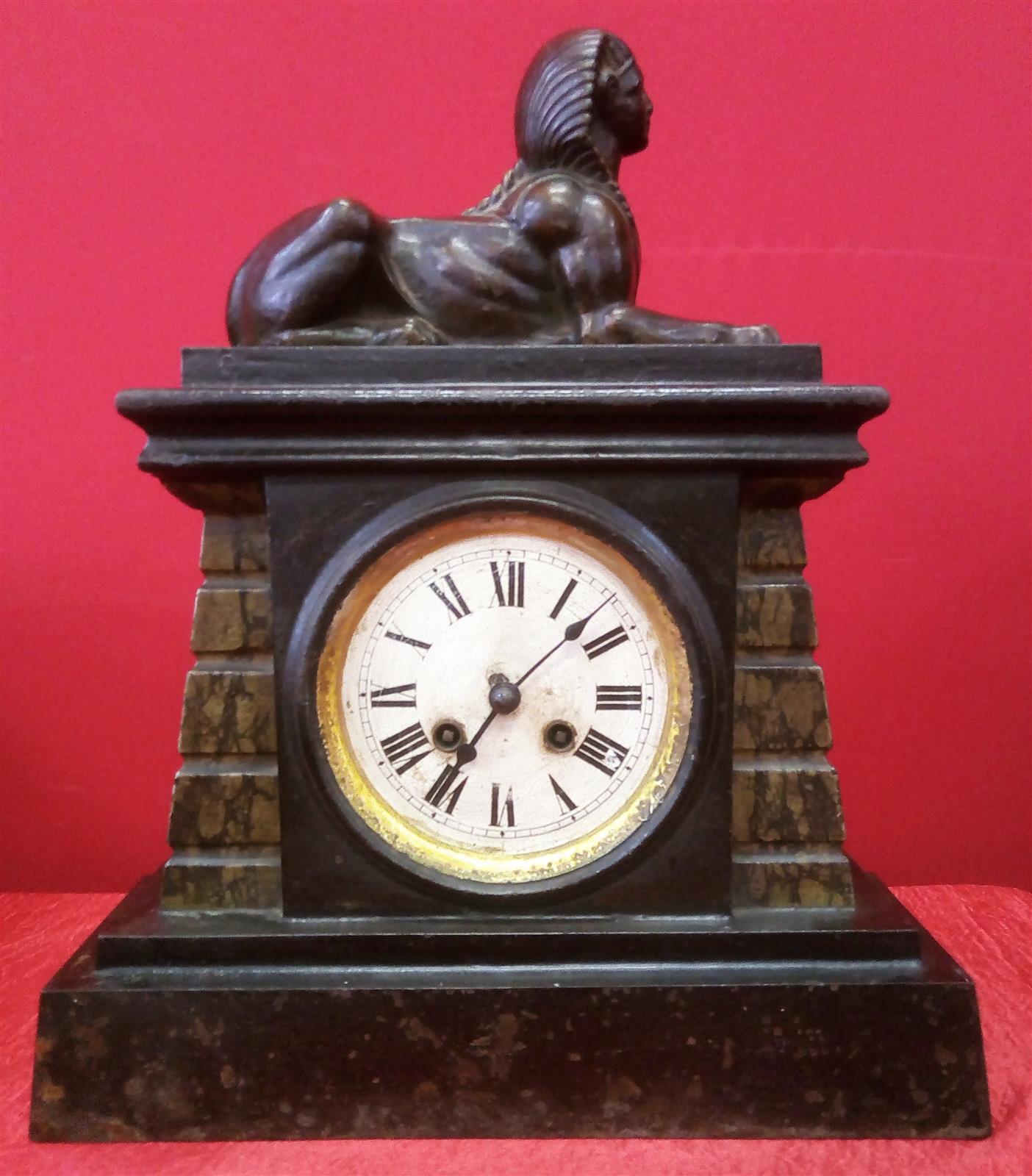 Pendulum clock with sphinx