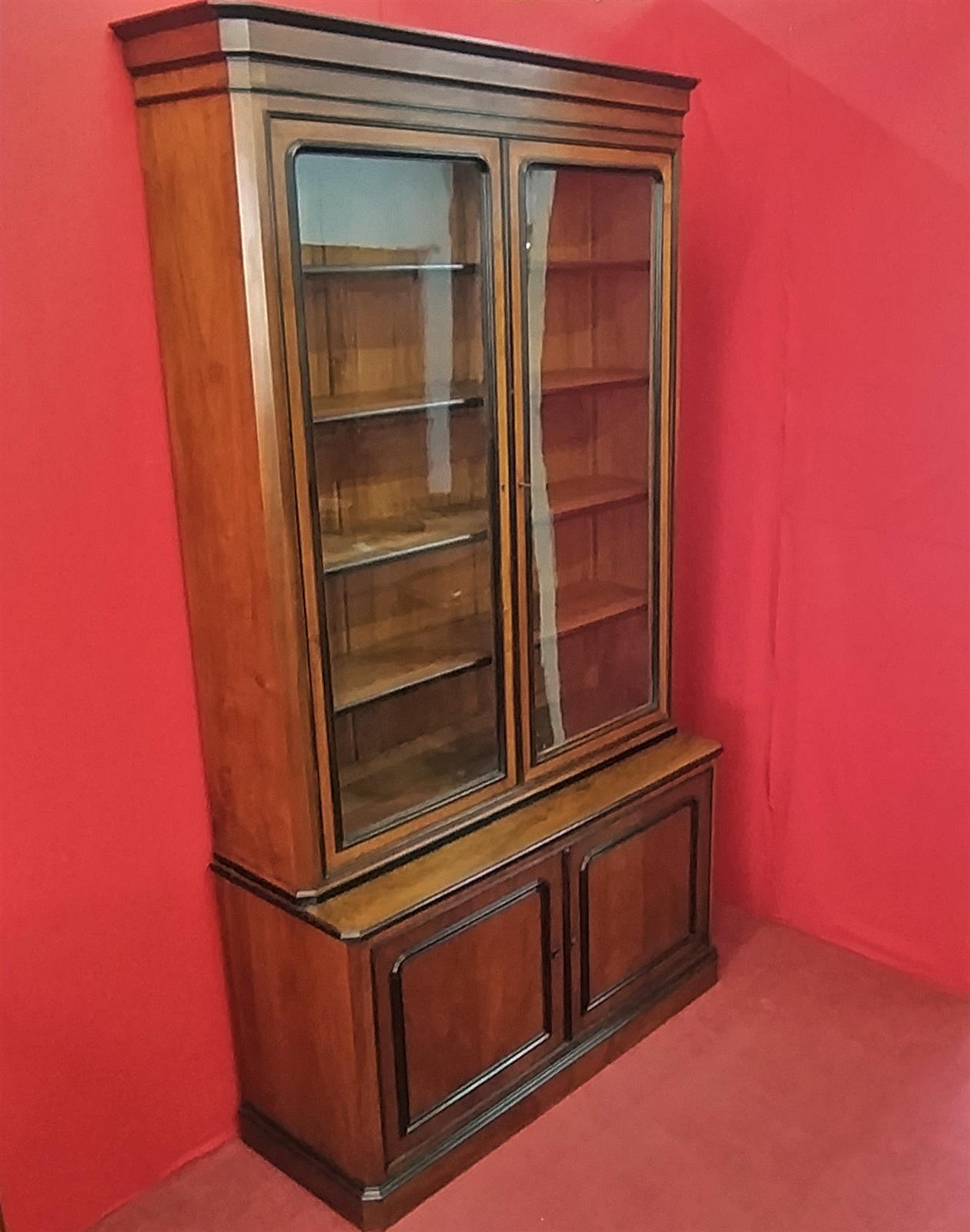 Walnut bookcase with black frames