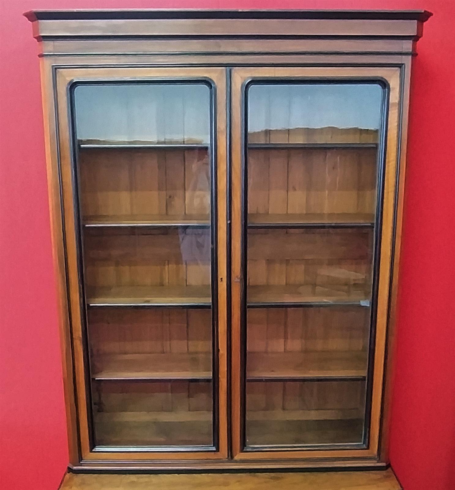 Walnut bookcase with black frames