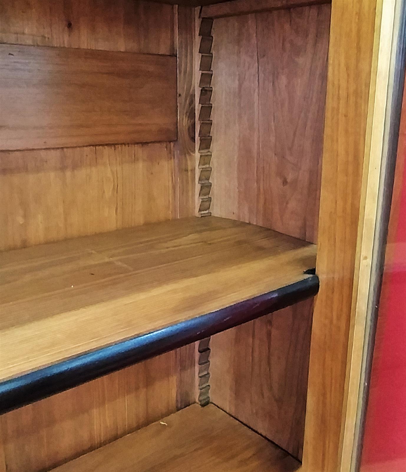 Walnut bookcase with black frames