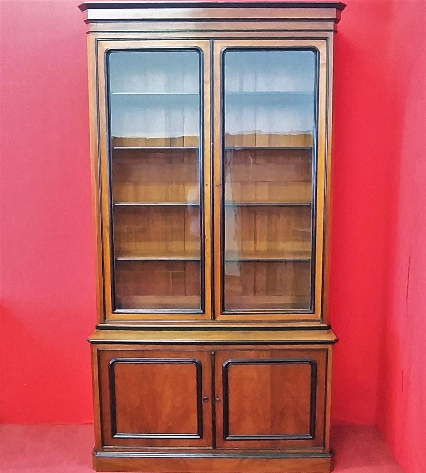 Walnut bookcase with black frames