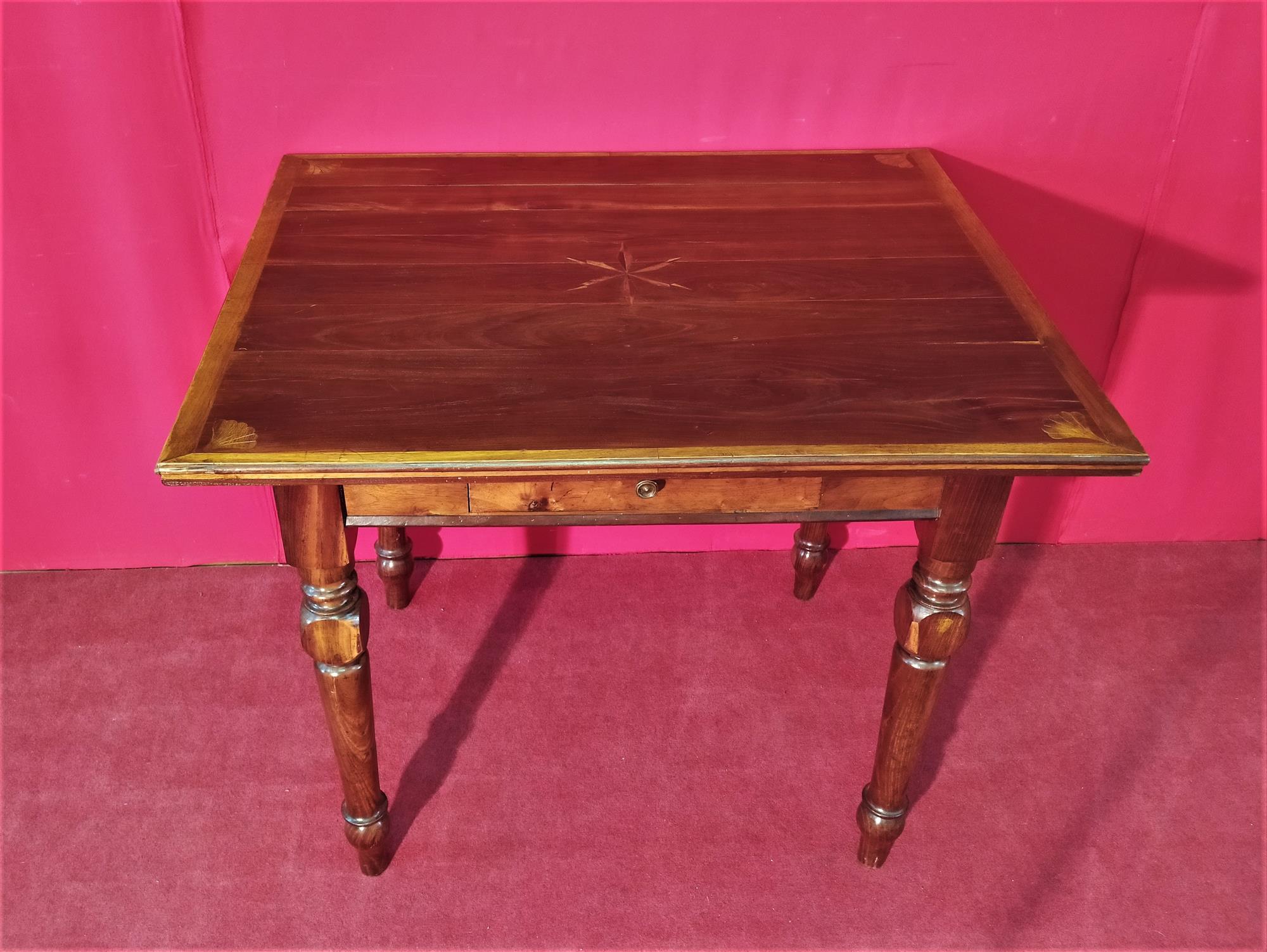 Coffee table with inlaid top and drawer