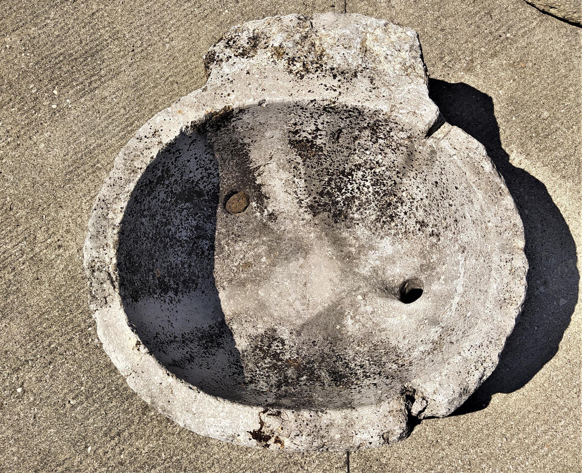 Holy water stoup in stone from the early 700s