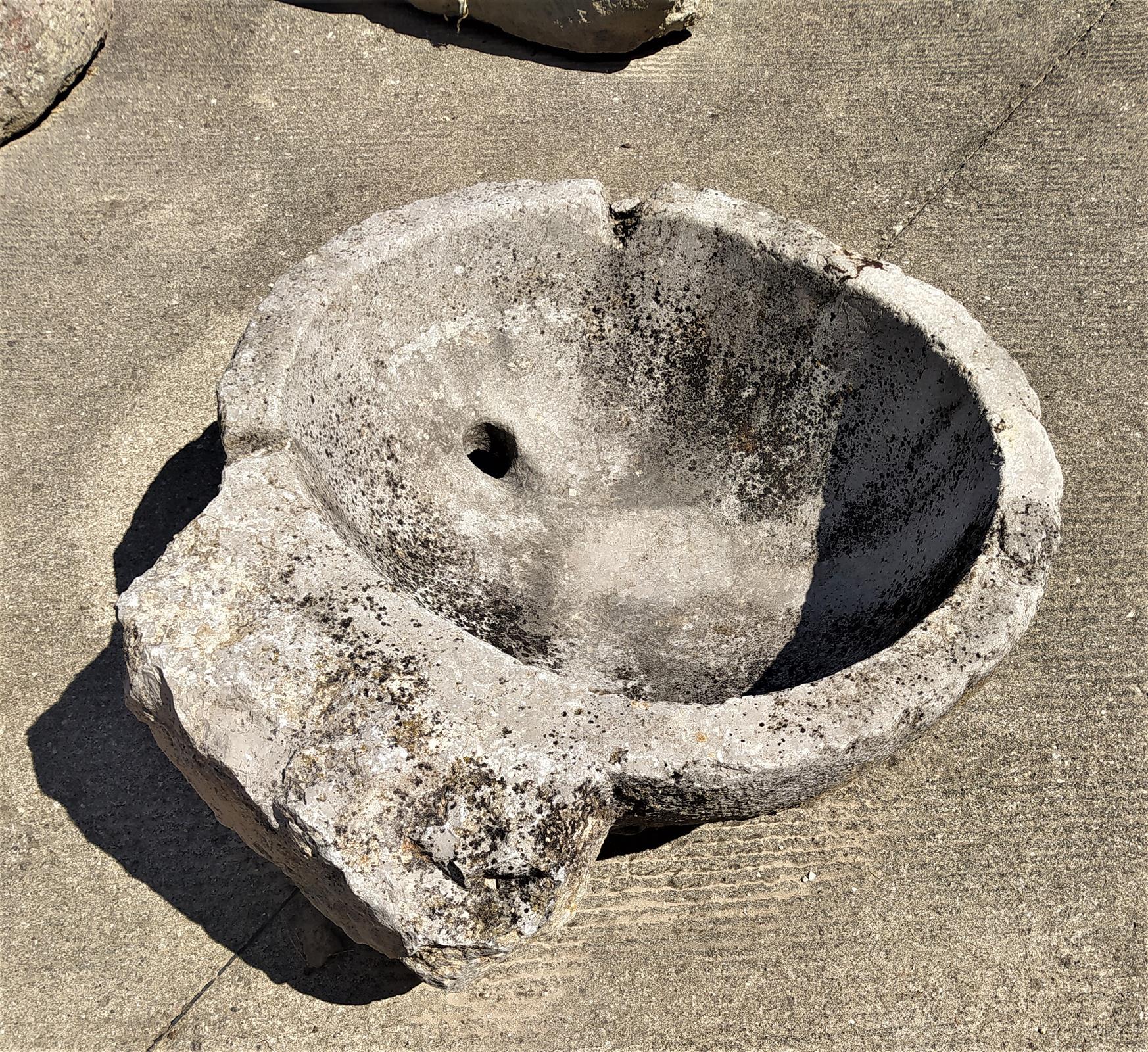 Holy water stoup in stone from the early 700s