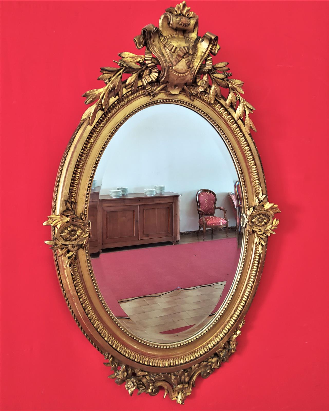 Golden oval mirror