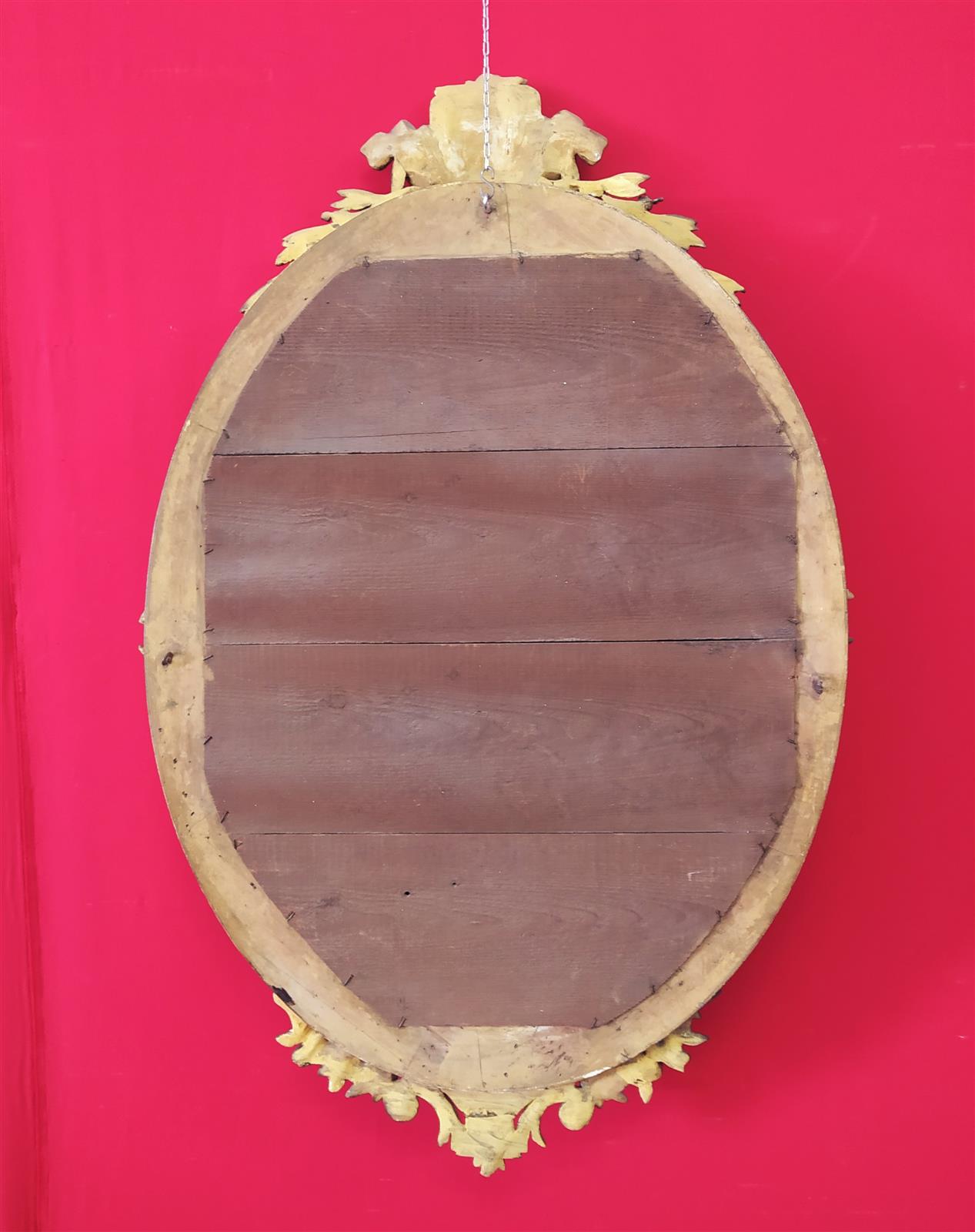 Golden oval mirror