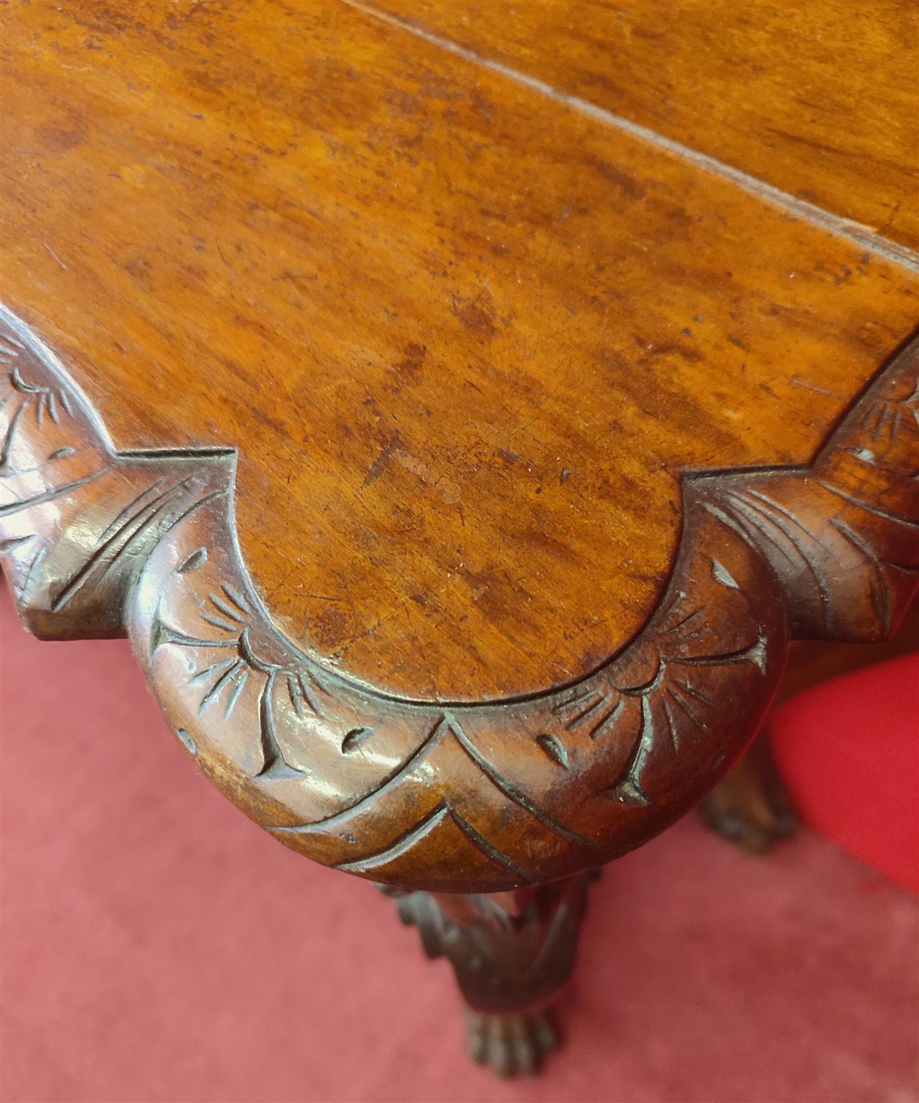 Italian console carved with children's faces