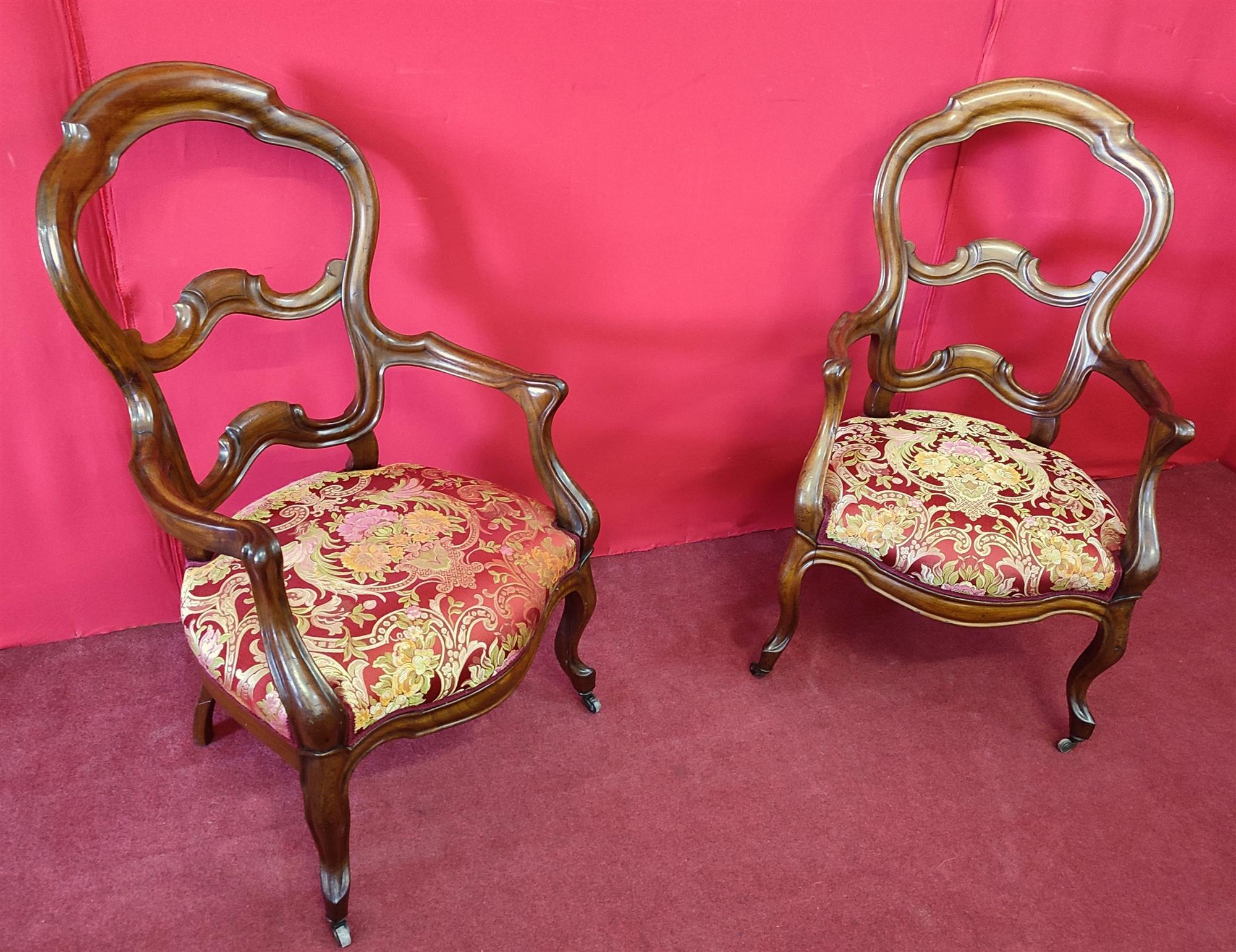 Pair of armchairs with open backrest