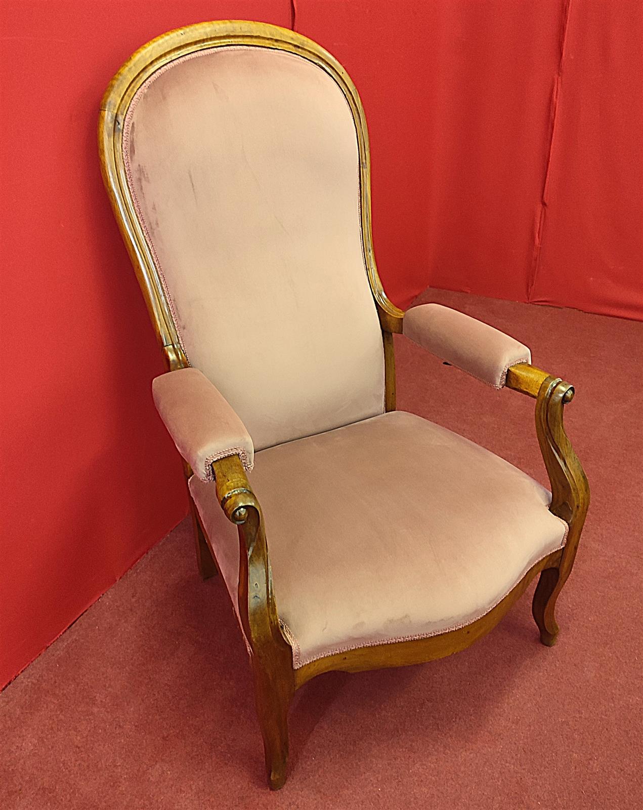 Armchair with reclining backrest